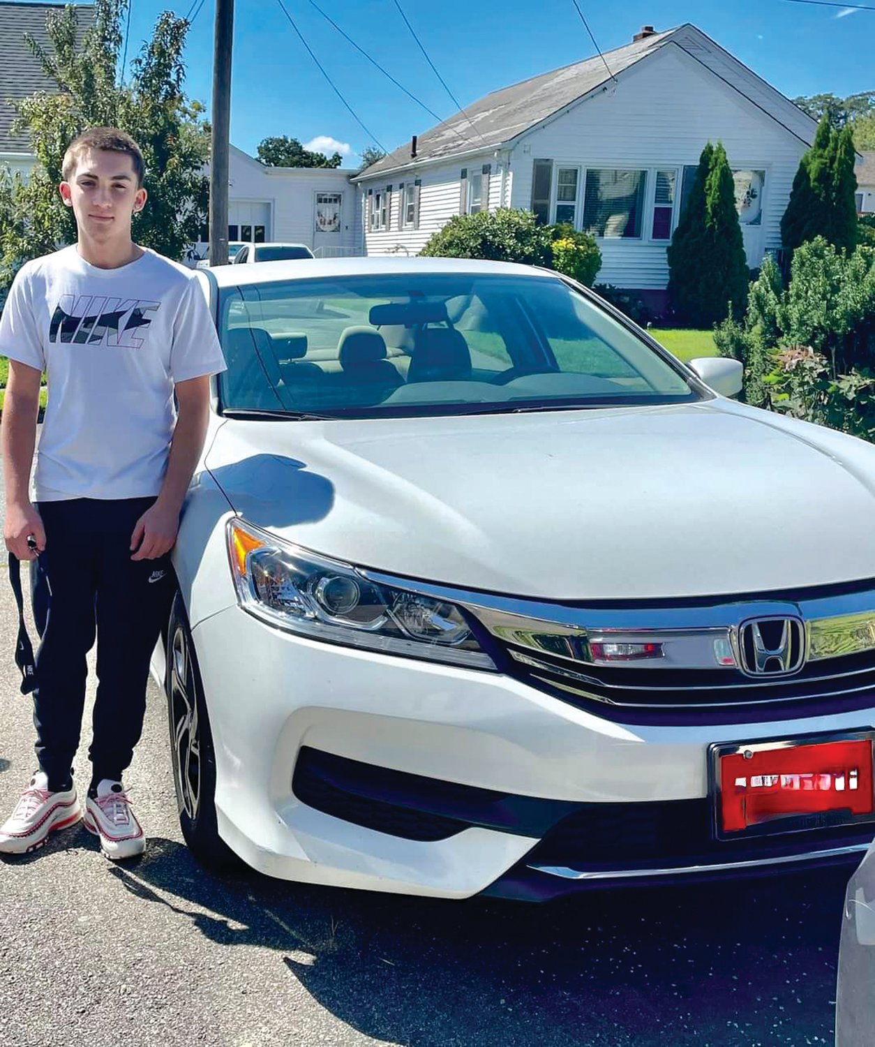 WITH HONDA: Sean poses with the 2020 Honda Accord he
purchased by working part-time as a culinary aide at the St.
Elizabeth Home in East Greenwich. (Courtesy of Gina Clapprood)